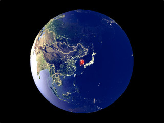 South Korea from space on model of planet Earth with city lights. Very fine detail of the plastic planet surface and cities.