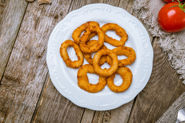 Rings of squid in batter with sauce