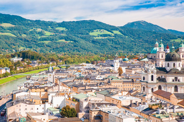 View of the city of Salzburg Austria with buildings, castle and hills