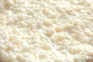 Fotobehang Delicious creamy rice pudding as background, closeup © New Africa