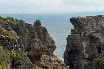 Fototapeta na wymiar Cliffs in the ocean, world famous Pancake Rocks, West Coast of South Island New Zealand