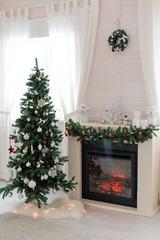 Fototapeta na wymiar Fireplace decorated for Christmas holidays