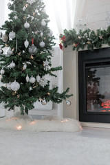 Fototapeta na wymiar Fireplace decorated for Christmas holidays