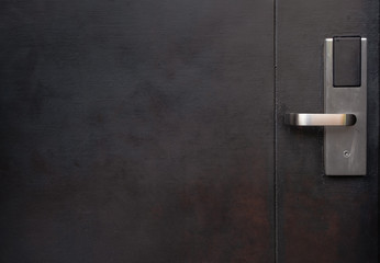 door knob with dark steel door for security concept with copy space