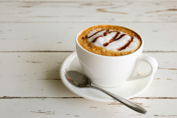 morning cappuccino coffee​  on vintage white wooden table
