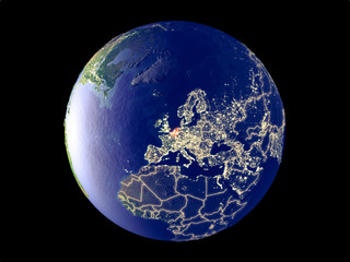 Benelux Union from space on model of planet Earth with city lights. Very fine detail of the plastic planet surface and cities.