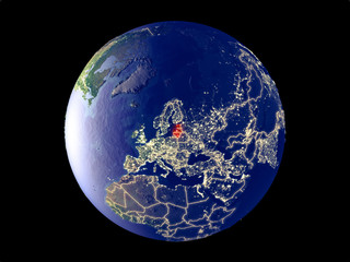 Baltic States from space on model of planet Earth with city lights. Very fine detail of the plastic planet surface and cities.