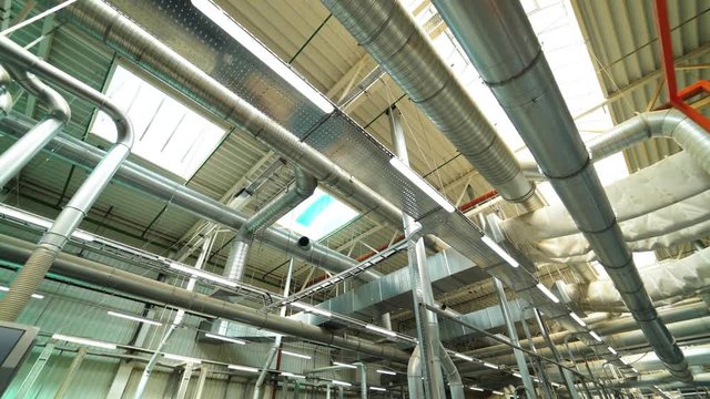 View of the ventilation system of the parquet factory. Camera motion to forward