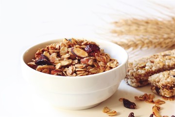 Homemade Granola in a bowl on white background, selective focus