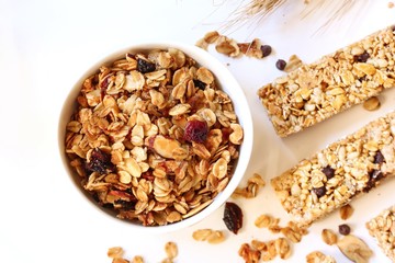 Homemade Granola in a bowl on white background, selective focus