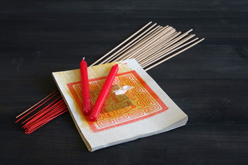 Joss money papers, incense sticks and candles for Chinese hungry ghost festival and tomb sweeping...