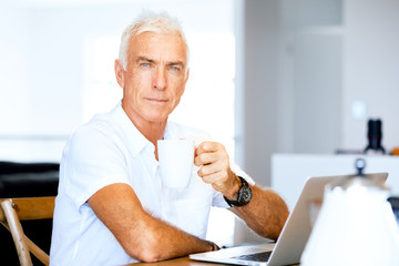 Man working on laptop at home