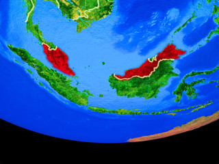 Malaysia from space on model of planet Earth with country borders.