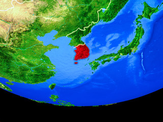 South Korea from space on model of planet Earth with country borders.