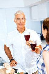 Portrait of a couple having a glass of red wine