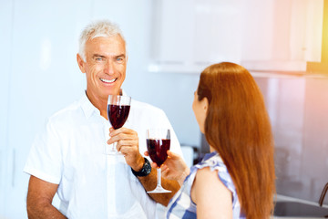 Portrait of a couple having a glass of red wine