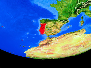 Portugal from space on model of planet Earth with country borders.