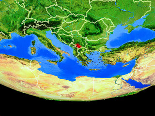 Kosovo from space on model of planet Earth with country borders.