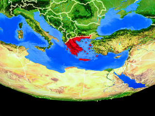 Greece from space on model of planet Earth with country borders.