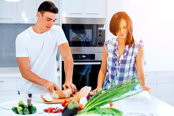 Couple cooking together at home
