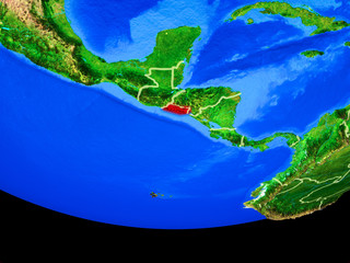 El Salvador from space on model of planet Earth with country borders.