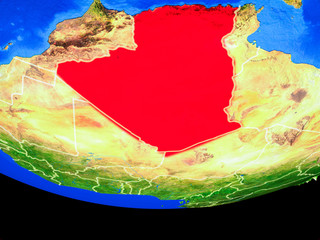 Algeria from space on model of planet Earth with country borders.