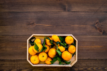 pile of tangerines for New Year and Christmas celebration on wooden background top view mock up