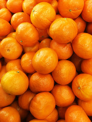 Healthy fruits, orange fruits background many orange fruits - orange fruit background in a supermarket super store