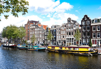 Canal boats moored in a residential neighbourhood in Amsterdam