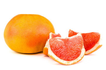 Fresh whole and sliced grapefruit on white background.