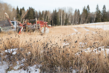 grass field with farm machinery 