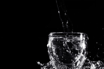 Water splash from the transparent glass