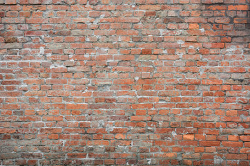 old vintage and grunge red brick wall background texture with scratches and cracks