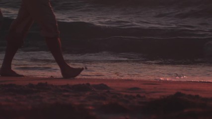Low angle of couples feet on shore