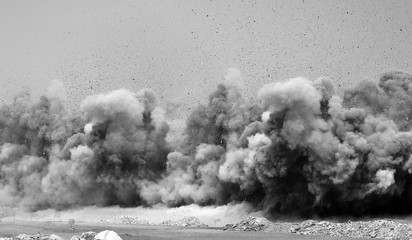 Flying rock particles after the blast on the construction site