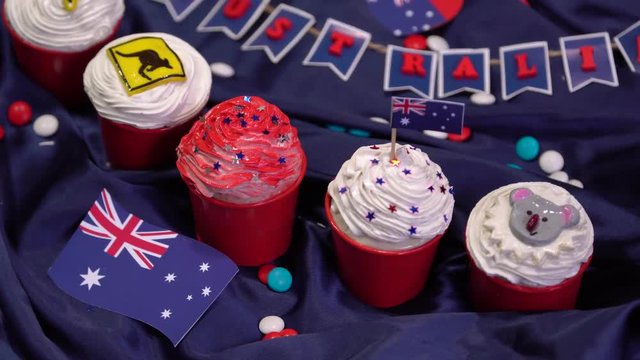 National Holiday in Australia. Handmade decorated cupcakes. Flag, kangaroo road sign, boomerang, seven-pointed star, koala