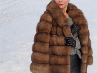 Beautiful fur coat, natural fur. Fashion for cold winter. 