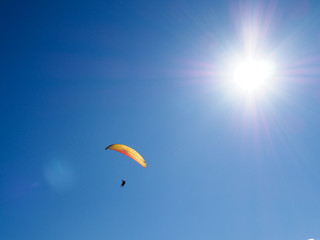 paragliders against the blue sky and mountains