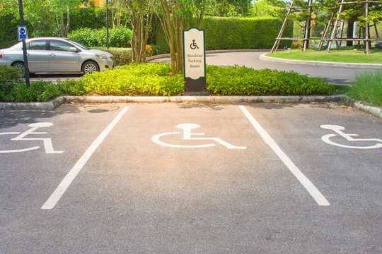 Empty Handicap Parking Areas In Parking Lot Reserved For Disabled People At Outdoor. (Selective Focus)