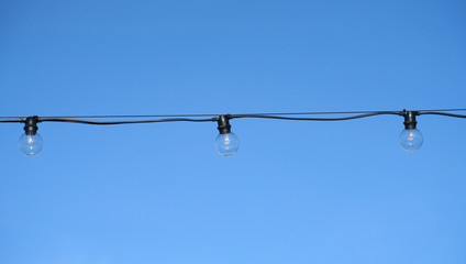 close up on light bulb under blue sky