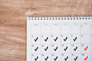 Calendar and check. Employee days or schedule filled.  カレンダーとチェック