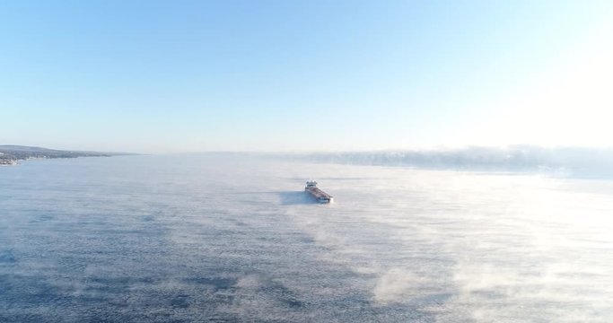 Cargo Ship Cruising on Lake Superior in Winter - Aerial Landscape