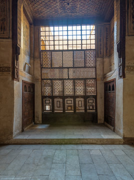 Interleaved wooden window (Mashrabiya), wooden embedded cupboards, and wooden decorated ceiling at ottoman historic Beit El Set Waseela building (Waseela Hanem House), Old Cairo, Egypt
