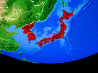 Japan and Korea from space on model of planet Earth with country borders.