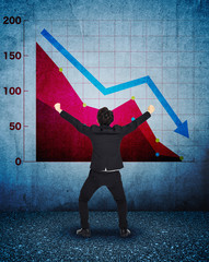 stressed businessman with falling down business chart background