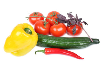Red tomatos and pepper on white background