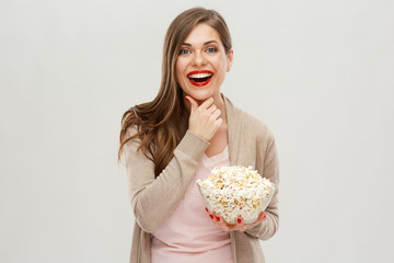 Happy woman portrait with popcorn glass bucket.