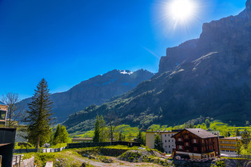 Fototapeta na wymiar Sun rays in Swiss Village in Alp mountains, Leukerbad, Leuk, Vis
