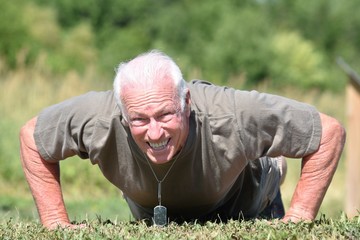 Male Veteran And Muscles Exercising