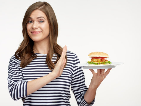 Woman diet concept with girl rejected burger.